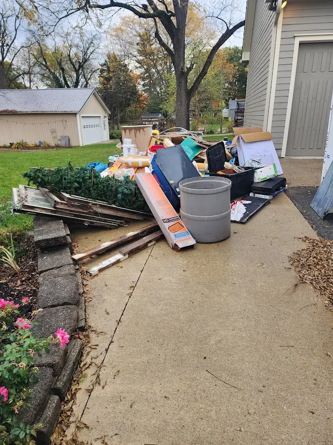 Dumpster being loaded with debris for 3 Yard Dumpster Rental in Wesley Chapel